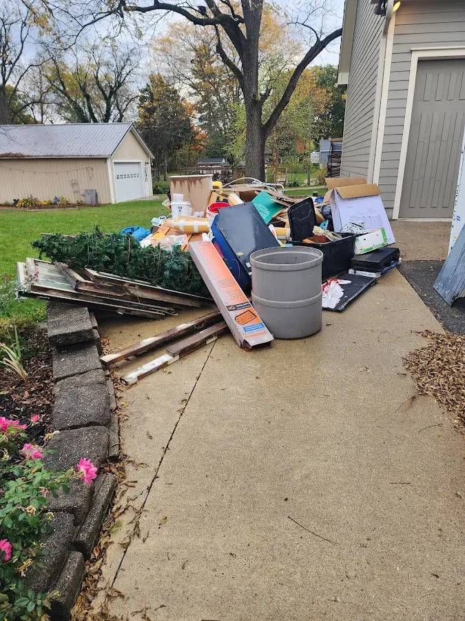 Dumpster being loaded with debris for Commercial Dumpster Rental in Auburn